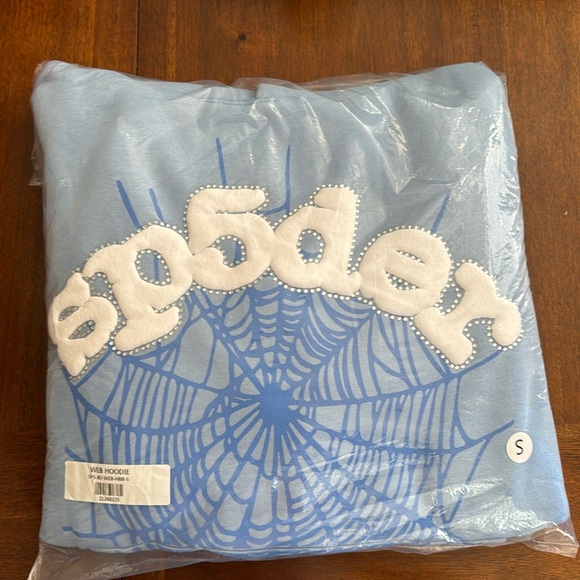 Brand: Sp5der it’s a Size Small pullover hoodie it’s a baby blue